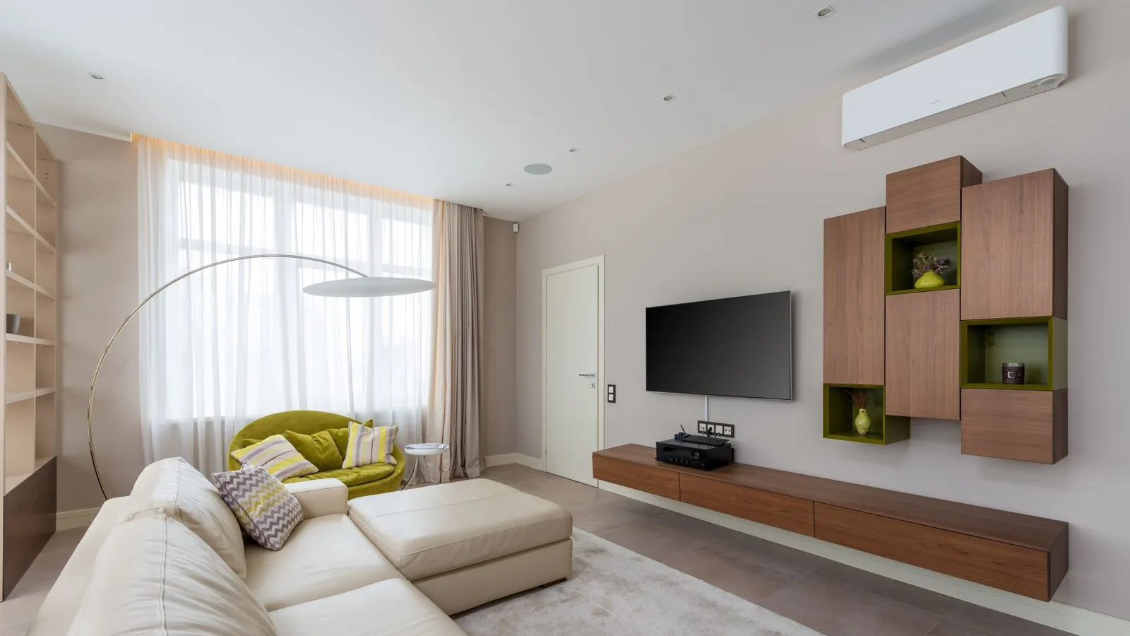 3-zone DIY mini split heat pump: wall-mounted ductless indoor unit in a living room, one of three zones on a 27K–36K BTU multi zone system